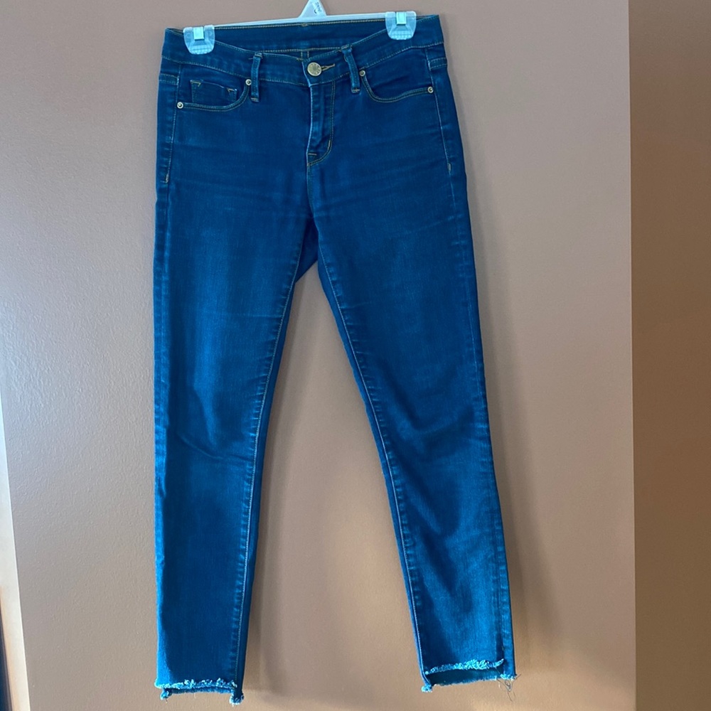 BDG ladies jeans in size 26 with raw edge hem.